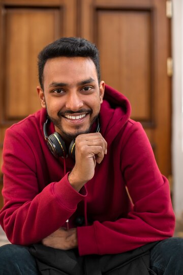 front-view-smiley-man-with-headphones_23-2149915902